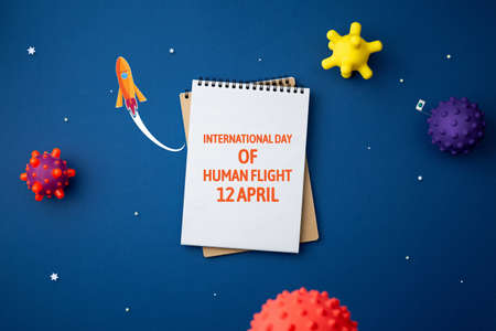 international day of human space flight. 12 april world cosmonautics day. spiral notebook on...