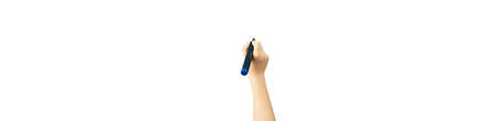 Children hand with marker write on an isolated white background. Writing hand. Hand holding black Pen. Wide image.の写真素材