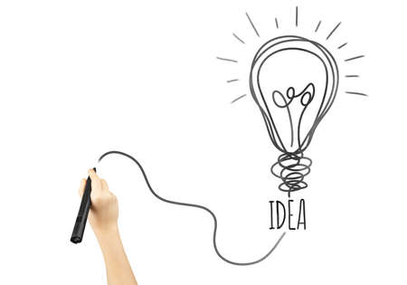 marker in hand with the word idea and light bulb symbol. Concept creation on the stage ideas and the birth of good idea on white isolated backgroundの写真素材