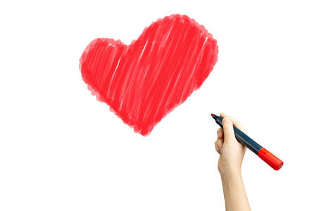 marker in hand painted a red heart on a white isolated background. heart symbol of love, help and care for those in needの写真素材