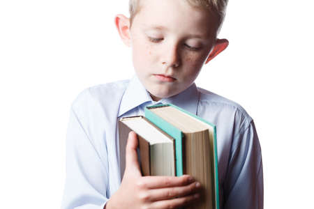 frightened boy with books in hands, portrait on isolated white background, schoolboy with book in...