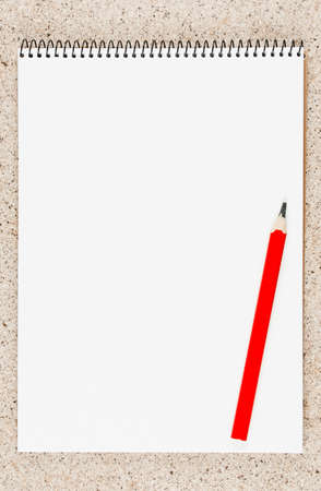 open notebook with pencil on the table top view, spiral notepad with blank page. flat lay of office concept , vertical viewの写真素材