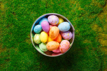 easter composition top view. eggs in the nest on green grass background flat lay with space for...