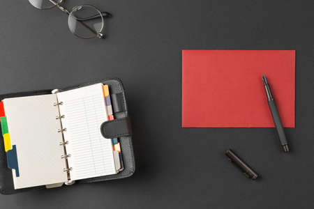 Envelope with fountain pen organizer and glasses.の写真素材