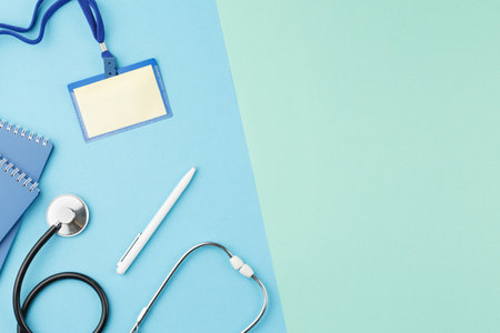 Badge with a stethoscope on the nurse desk.の写真素材