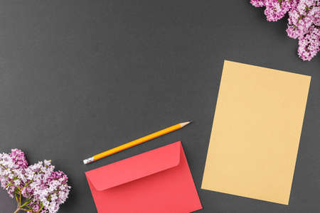 Notebook with pen and lilac.