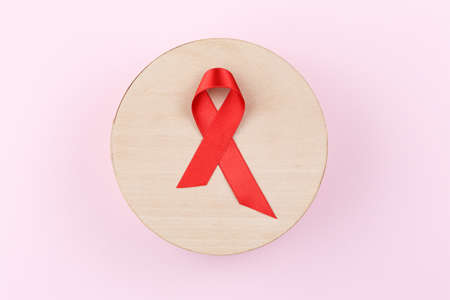 Red ribbon. Cancer control symbol.