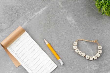 Notebook office work on gray marble background