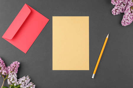 Notebook with pen and lilac.