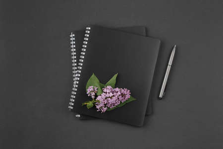 Notebook with pen and lilac.の写真素材