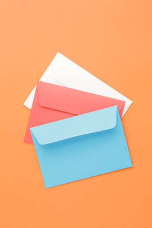 Multicolored paper postal envelopes. Top view