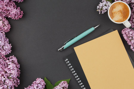 Notebook with pen and lilac.の写真素材