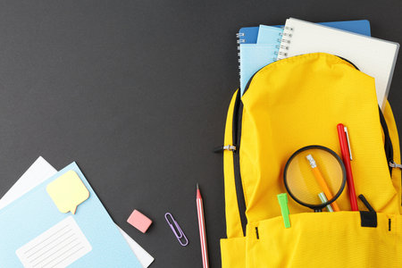 School supplies in a yellow backpack.の写真素材