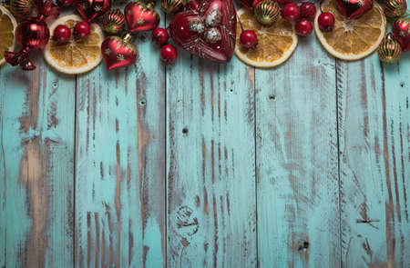 New year's background on a light geen desk decorated with Christmas decoaration and candles. Bright...