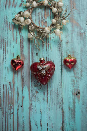 New year's background on a light geen desk decorated with Christmas decoaration and candles. Bright colored Horizontal background symbolizes the new year celebration. Copy space.の写真素材