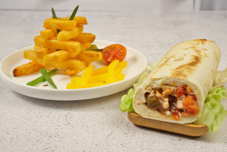 Doner kebab with vegetables and french fries