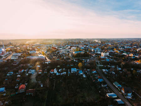 Golden red sunlight AERIAL view, Russia, River, small town, bridgeの写真素材