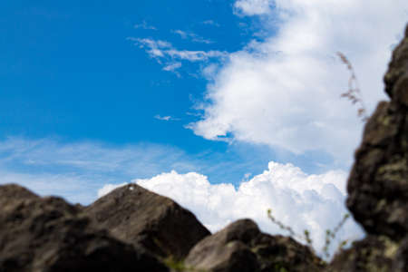 Stone rocks in the foreground, sky in focus on the backgroundの写真素材