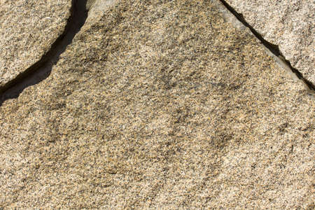 The granite surface of the wall is light brown in color.の写真素材