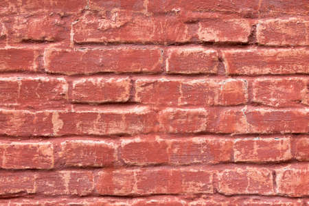 An old brick masonry wall of a warehouse made of red brick.の写真素材
