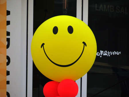 the ball stand near the entrance and invites you to come insideの写真素材