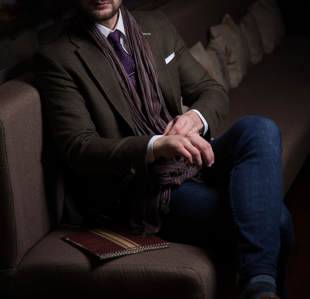 Male model in a suit posing in a restaurant