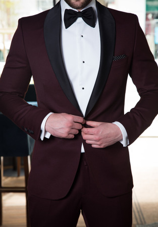 Male model in a suit posing indoors.の写真素材