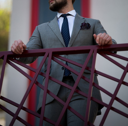 Male model in a suit posing outdoorsの写真素材