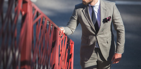Male model in a suit posing outdoorsの写真素材