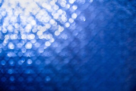 Defocused abstract blue night backgroundの写真素材