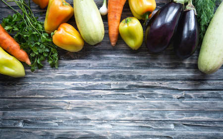 Healthy raw summer vegan vegetables and herbs. Organic harveest. Healthy food, clean eating, vegeterian food concept. Flat lay, copy space for textの写真素材