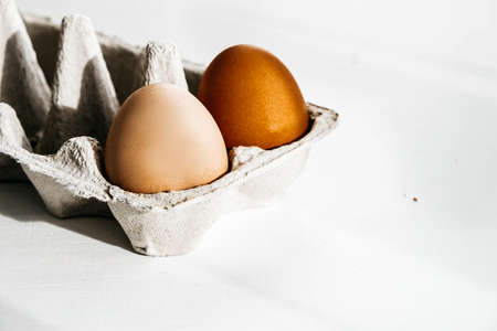 Minimalist organic food concept. Brown eggs in carton cardboard boxの写真素材