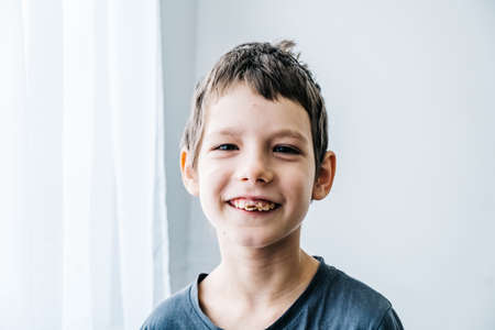 Happy autism boy wearing a toy crown and smile. Life style autism inclusion and autism awareness conceptの写真素材