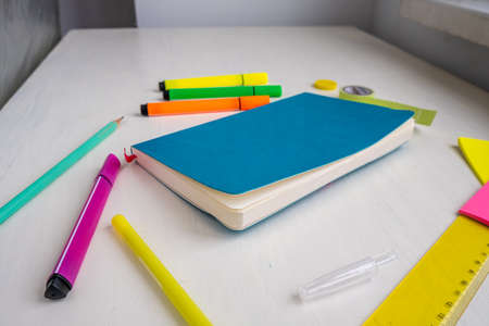 Turquoise cover planner with a pen, markers, ruler, stickers.. Planning and smart time management conceptの写真素材