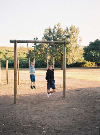 Dad and son, sport training on playground together. Father and son spend time together concept.