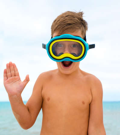 Child on the beach with swimming mask. Boy on vacation at seaの写真素材