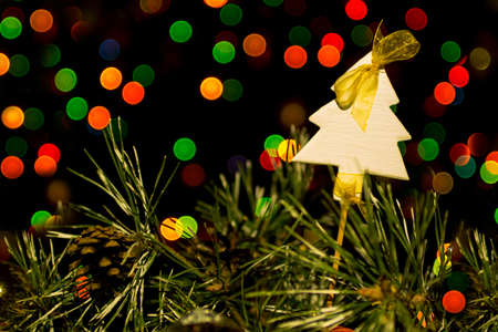 white wooden Christmas tree on lights bokeの写真素材