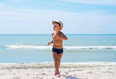 A boy having fun on the beach.の写真素材