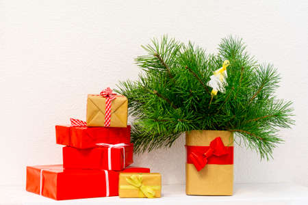 Christmas gift boxes. Christmas presents in boxes at white wooden table.の写真素材
