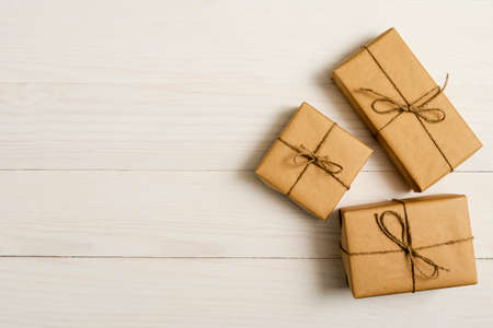 gift boxes package on white wooden backgroundの写真素材