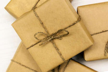 gift boxes package on white wooden backgroundの写真素材