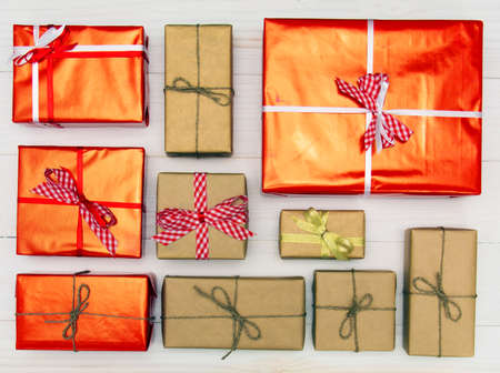 Gift boxes on white wooden background top view. Many gifts and surprises of gifts for Christmas, holiday.の写真素材