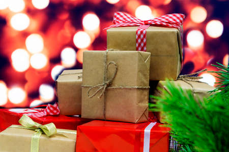 Many gift boxes on xmas tree backgroundの写真素材