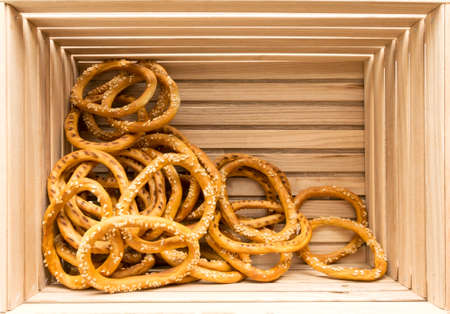 Bagels with sesame seeds on wooden background.