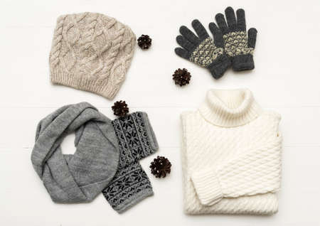 beauty clothes arrangement with hat, mittens, sweater, scarf. flat lay, top view