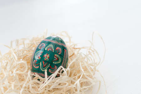 Easter eggs decoration on white wooden background.の写真素材