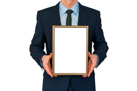 Mockup. Business man holding in hands empty blank photo frame.の写真素材