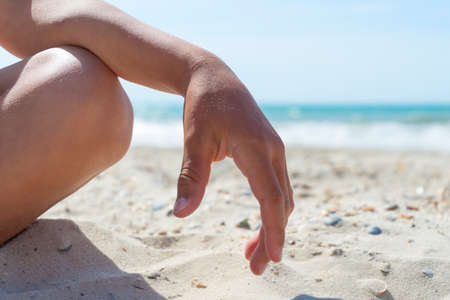 Boy In Relaxation On Beach with sand, body parts, lotus positionの写真素材