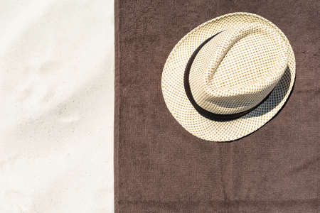 Top view of sandy beach with towel frame and summer accessories.の写真素材