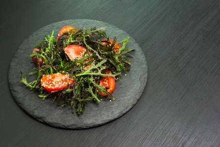 Healthy salad bowl on stone table. Top view with copy space
